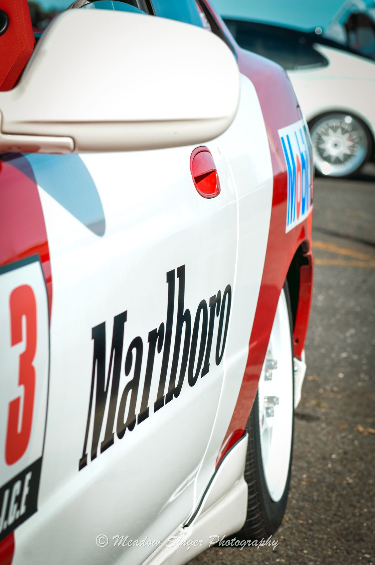 A white race car in red and white Marlboro livery