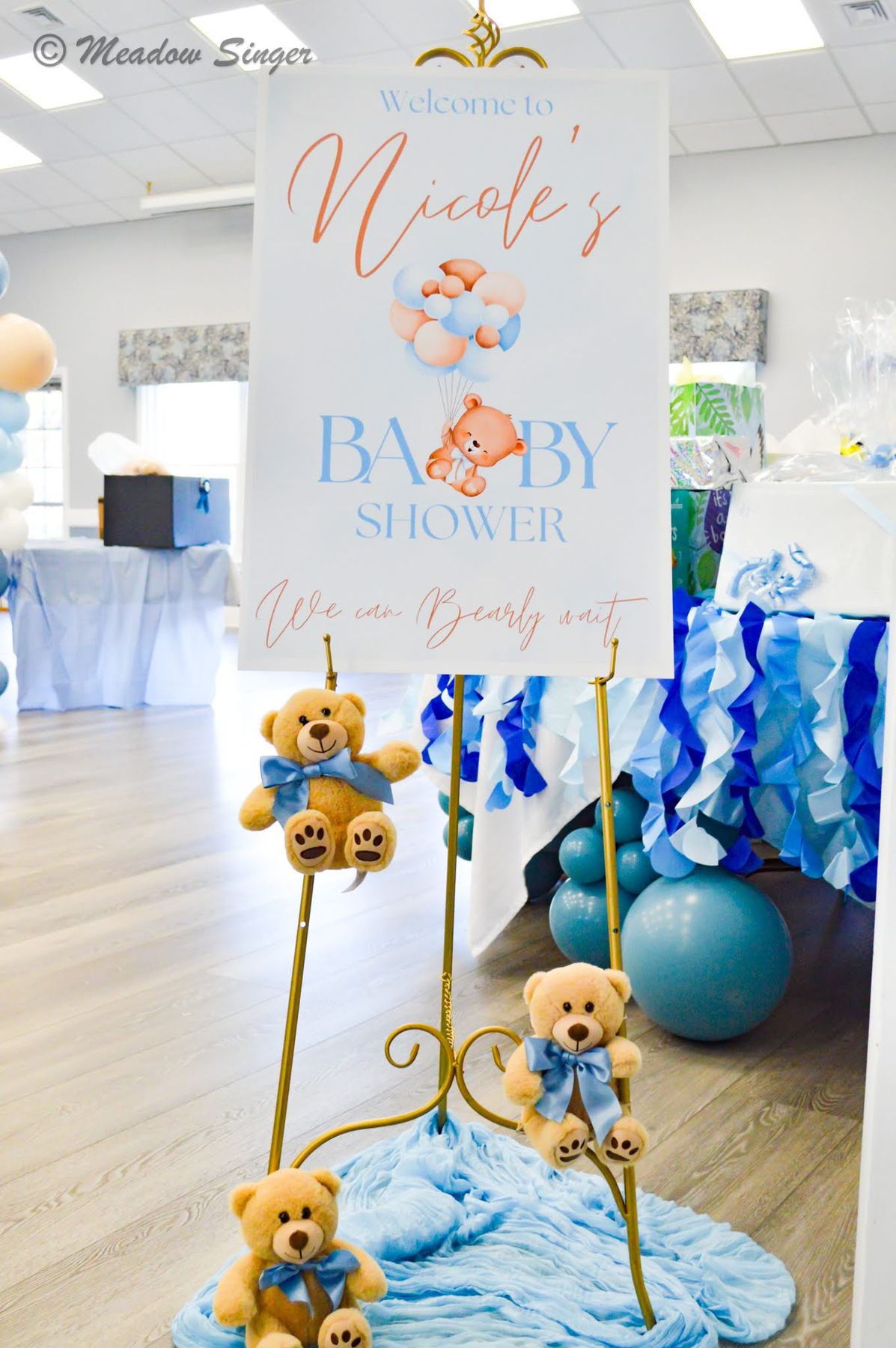 A baby shower welcome sign with blue teddy bears